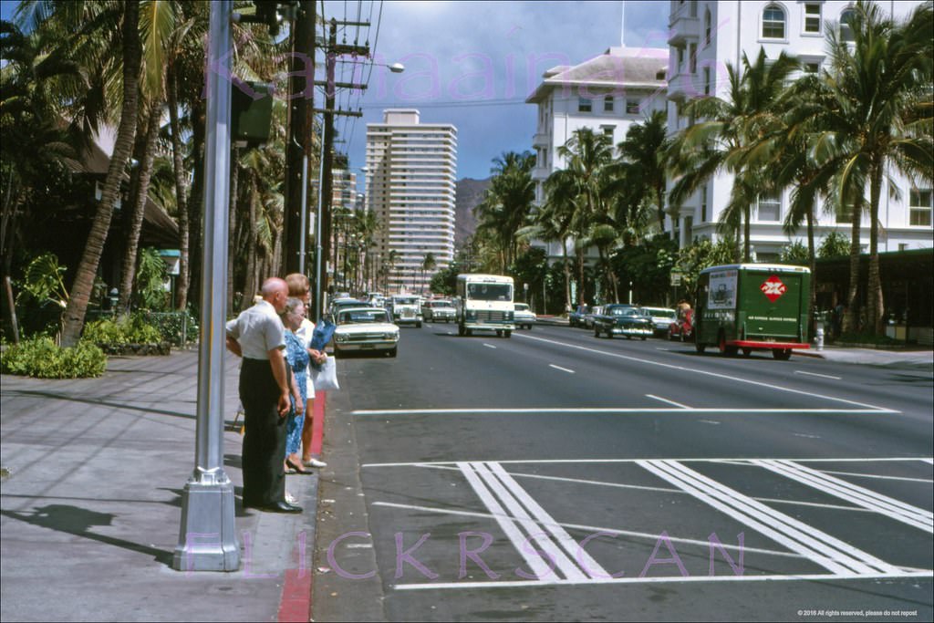 #92 Waikiki’s Kalakaua Avenue looking Diamond Head from the crosswalk in front of the International Market Place, 1963