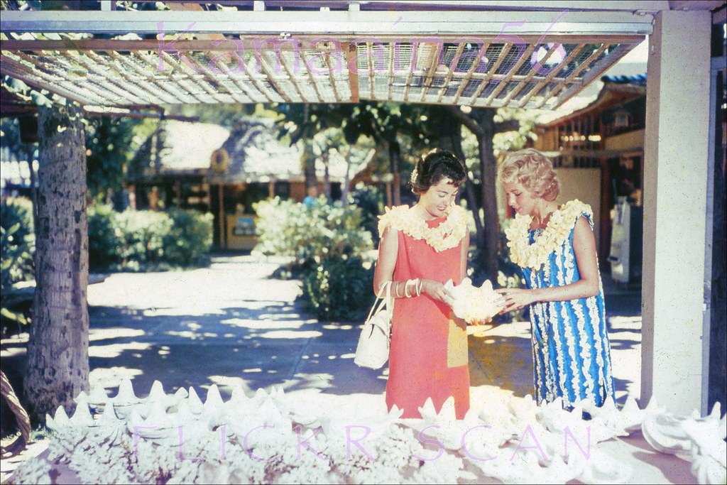 #133 Tourist shopping at a remarkably uncrowded International Market Place in Waikiki, 1959