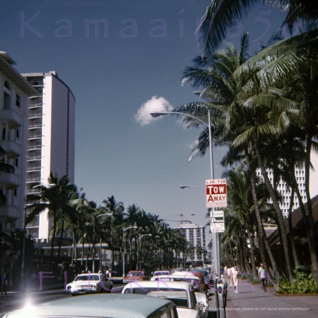 #101 New towers on Waikiki’s Kalakaua Avenue in this view looking Ewa (more or less west here) from the street front shops at the Princess Kaiulani Hotel, 1967