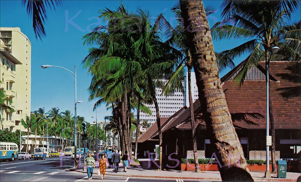 #102 Looking west along Waikiki’s Kalakaua Avenue from the Kaiulani Avenue intersection, 1960s