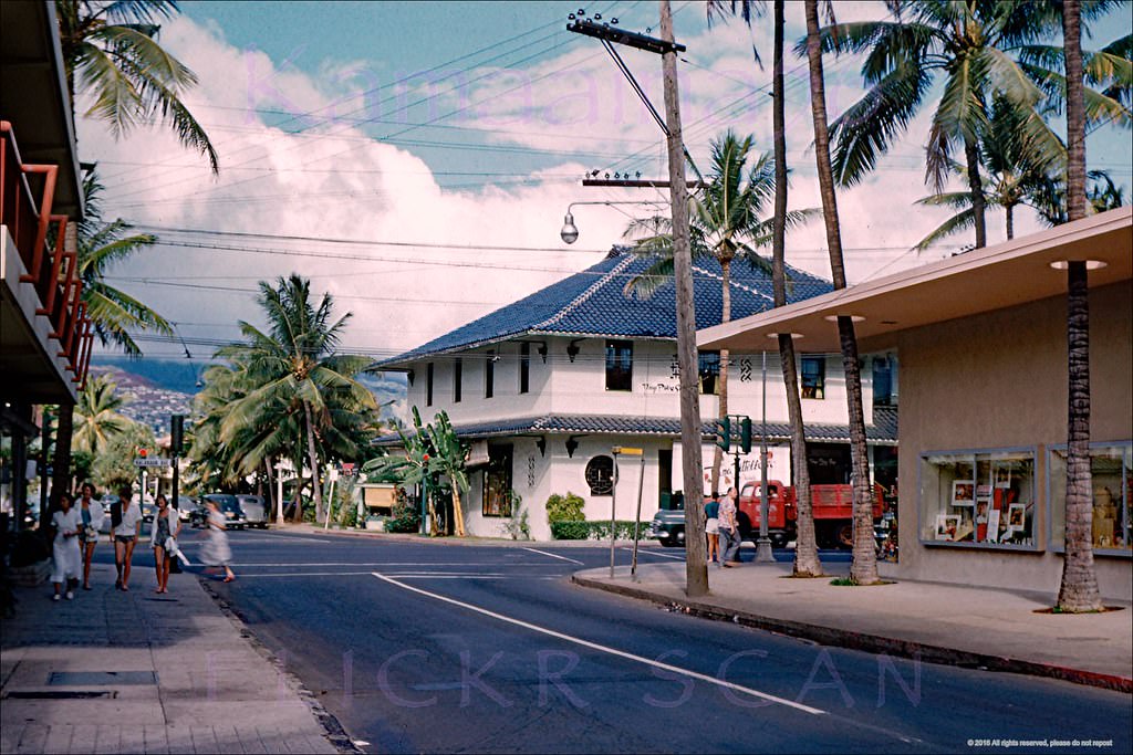 #142 Looking mauka along Lewers Street towards the Kalakaua Avenue intersection in an uncrowded Waikiki, 1950s