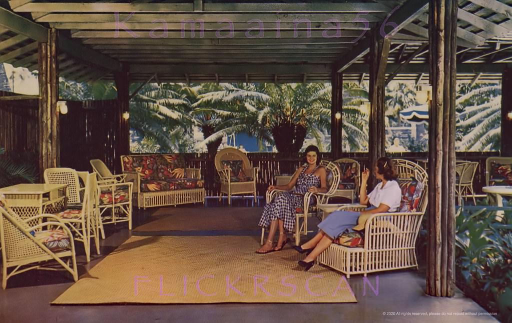 #36 Ladies enjoying a smoke in the rattan furnished Lanai Lounge at the Willard Inn, Waikiki, 1940s