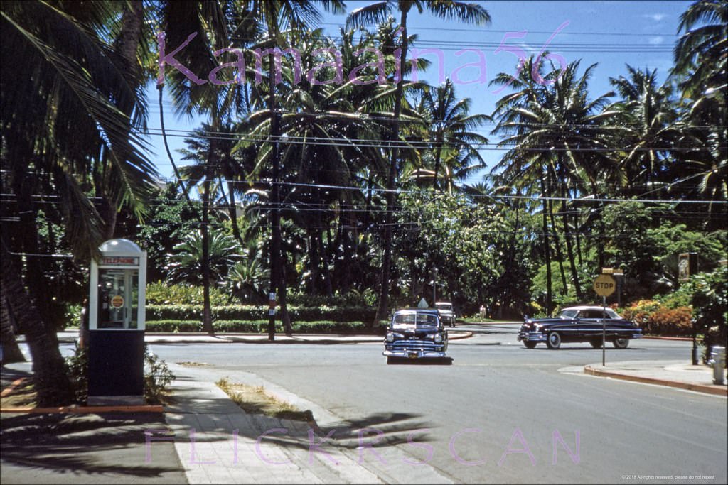 #216 Looking makai (more or less south here) at Waikiki’s Kalakaua Avenue from the corner of Seaside Avenue, 1953