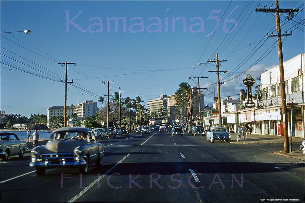 #234 Late afternoon westerly view along Waikiki’s Kalakaua Avenue from Paoakalani Avenue, 1956