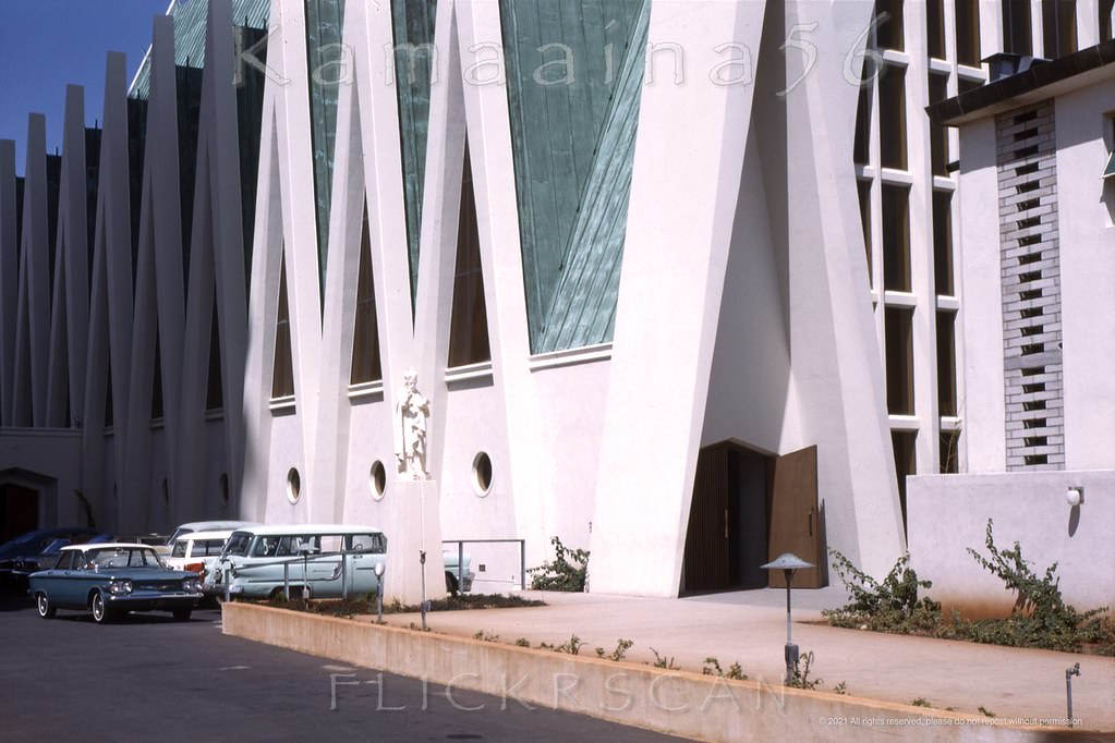 #184 St Augustine’s Catholic Church viewed from Waikiki’s Kalakaua Avenue with the Ewa (west) side of the church at left and the makai (ocean facing) front of the church at right, 1963