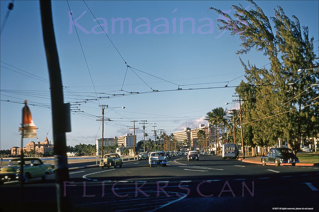 #236 Late afternoon ewa view along Waikiki’s Kalakaua Avenue at the Monserrat Avenue intersection, 1956