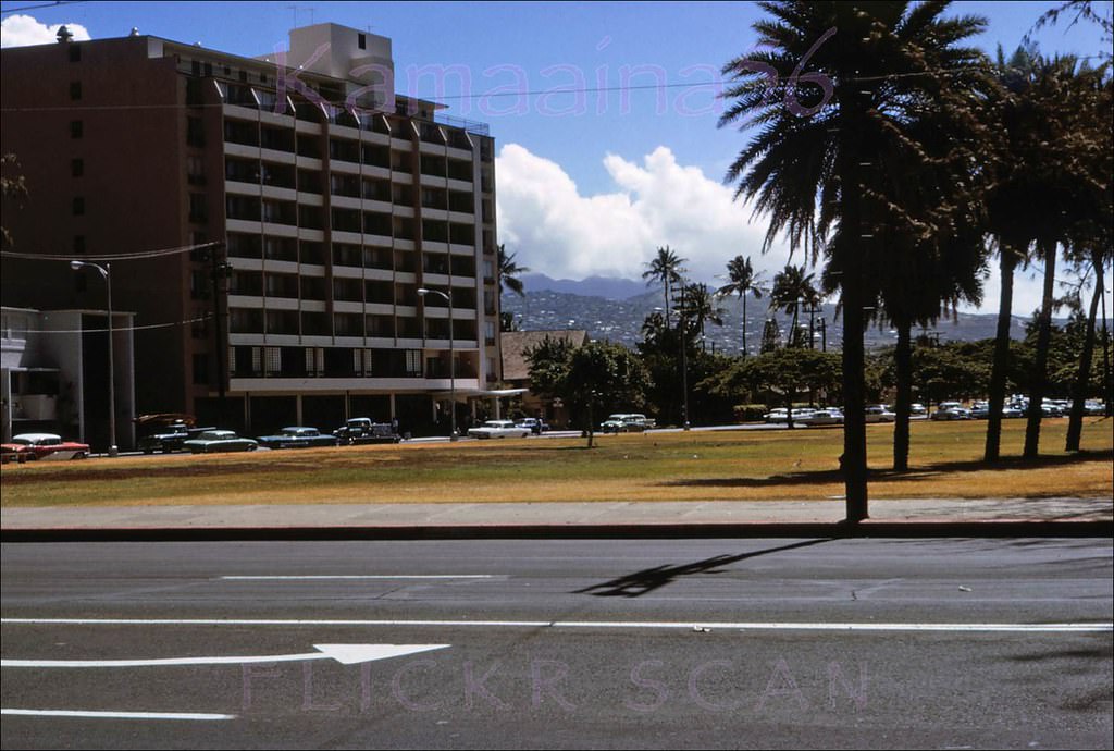 #185 Looking Mauka across Kalakaua Avenue towards the Waikiki Grand Hotel on Kapahulu Avenue facing the Waikiki Zoo, 1964