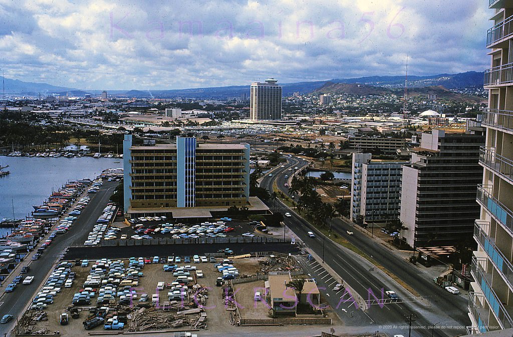 #157 Looking west towards Ala Wai Harbor and Honolulu along Ala Moana Blvd from the 26-story Ilikai Hotel, 1964