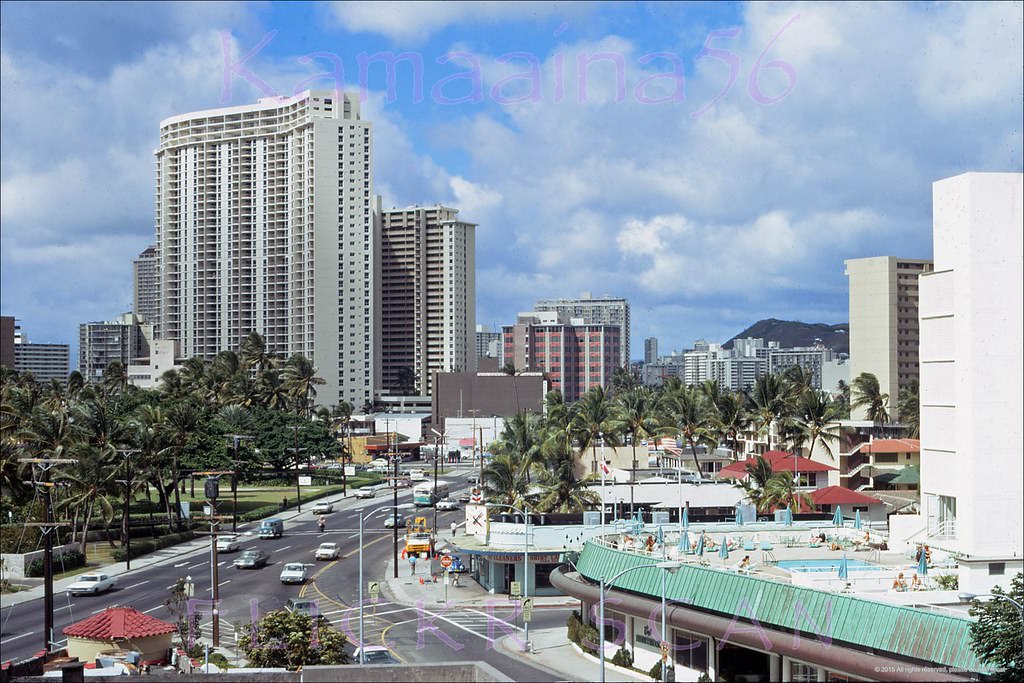 #18 Detailed birdseye view, probably taken from the Waikiki Terrace Hotel, looking west towards the intersection of Kalakaua and Kuhio Avenues, 1971