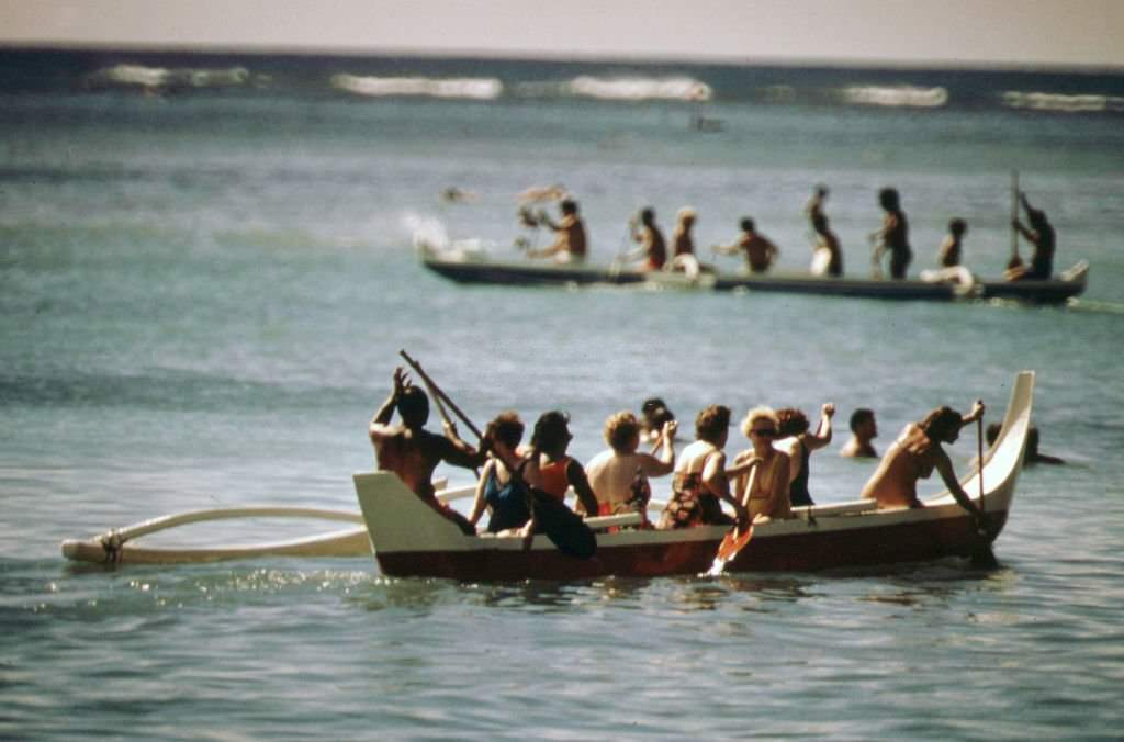 #12 Waikiki Beach visitors enjoy the outrigger canoe, October 1973
