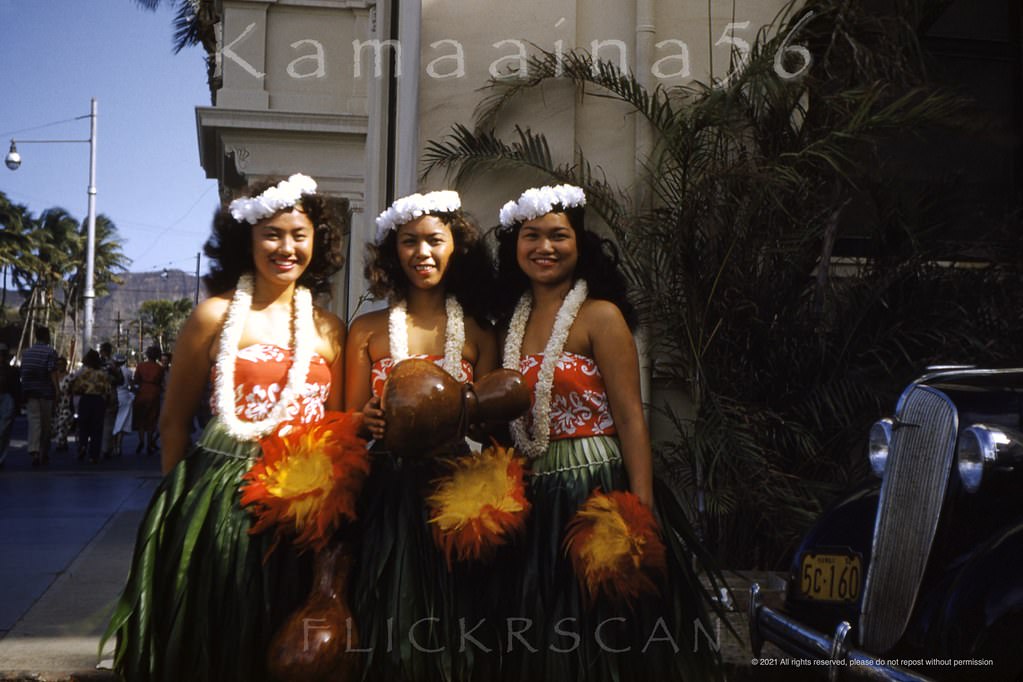 #55 A trio of pretty hula girls posing for a souvenir photo in the Moana Hotel’s porte-cochère on Waikiki’s Kalakaua Avenue, 1952