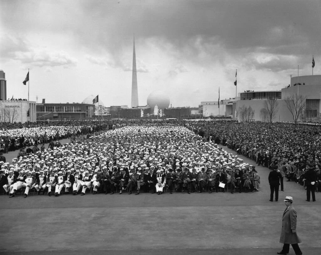 #131 Crowd at the opening ceremony of New York World’s Fair. The Trylon and Perisphere are in the background.