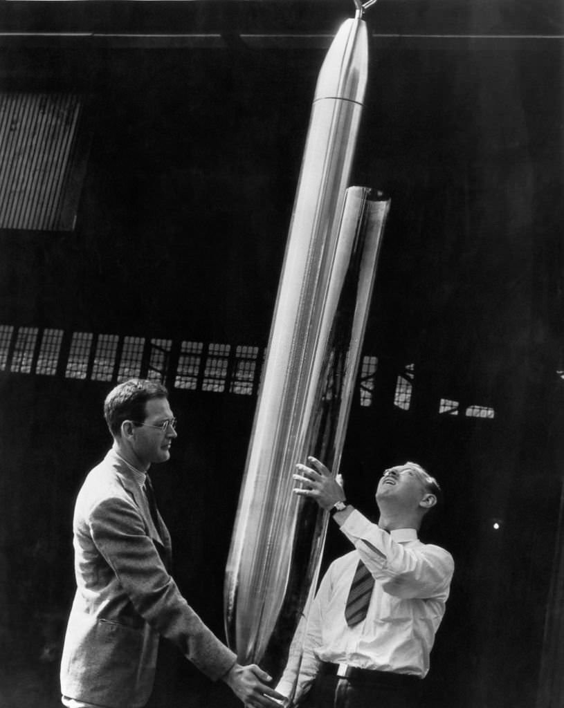 #133 The first Westinghouse Time Capsule, a 7.5 foot capsule with an inner shell of heat-resistant glass, is inspected by two experts before being shipped to the 1939 New York World’s Fair.