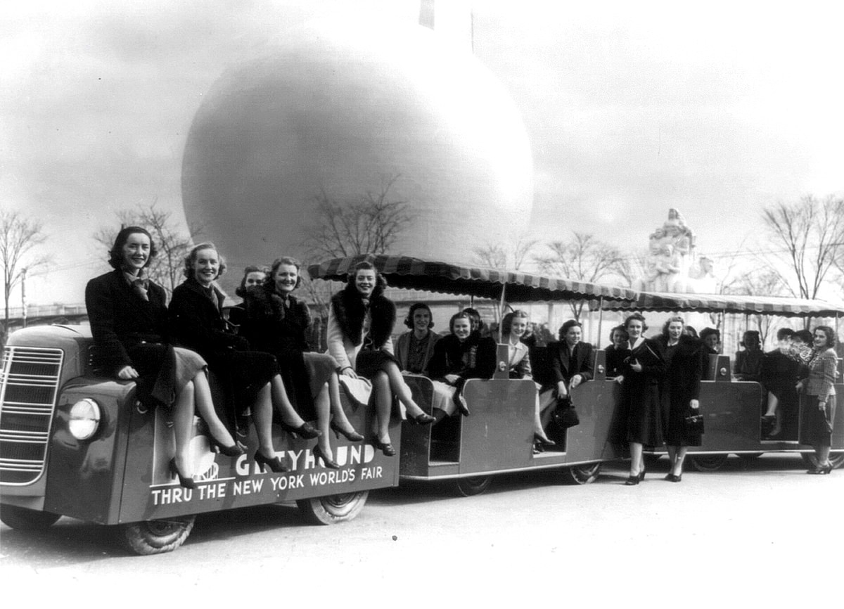 #29 Members of the New York World’s Fair staff, on a tractor train in 1939.