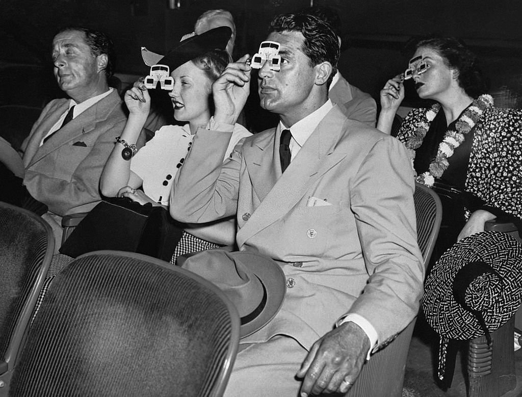 #92 Cary Grant and Phyllis Brooks at the Polaroid movie in the Chrysler Building at the New York’s World Fair.
