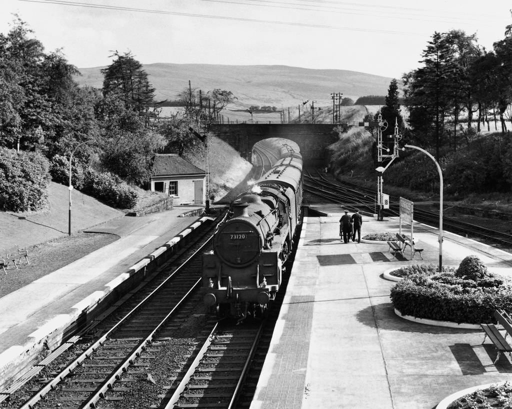 #75 Glasgow Buchanan Street-Inverness express at Gleneagles behind a standard class, 1962