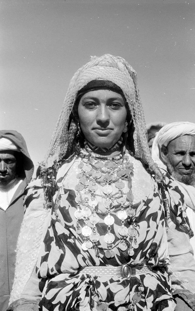 #95 Portrait of Berber woman in headscarf and Moroccan coin jewelry, 1960s