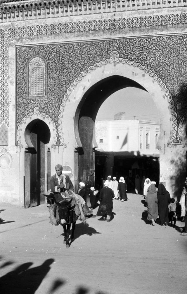 #112 Man riding mule through Blue Gate in Fez, 1960s