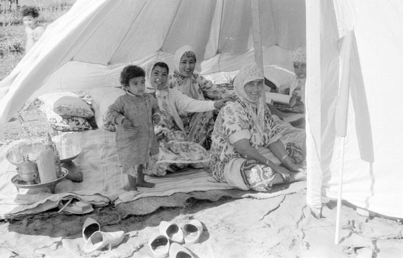 #113 Berber women and child inside tent at camp, 1960s