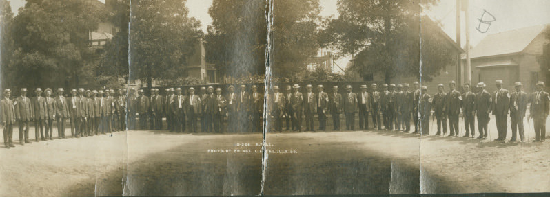 #9 Members of the Benevolent and Protective Order of Elks shown near houses in Bakersfield, 1909