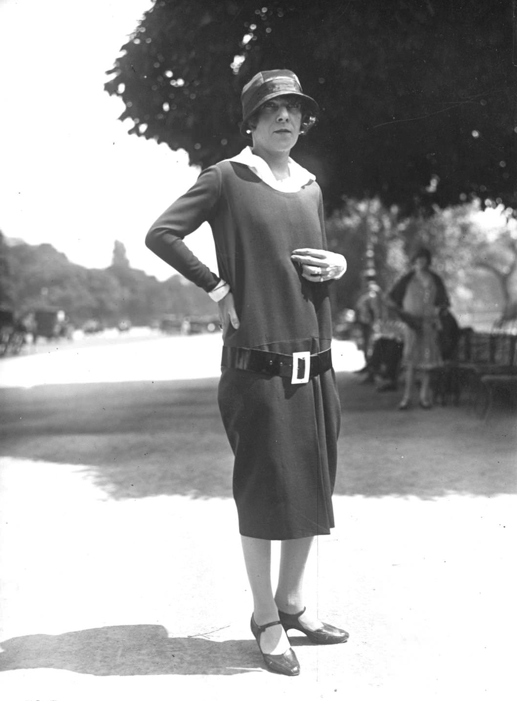 #104 A Parisian woman wearing a dress with a low slung belt and cloche hat, 1925