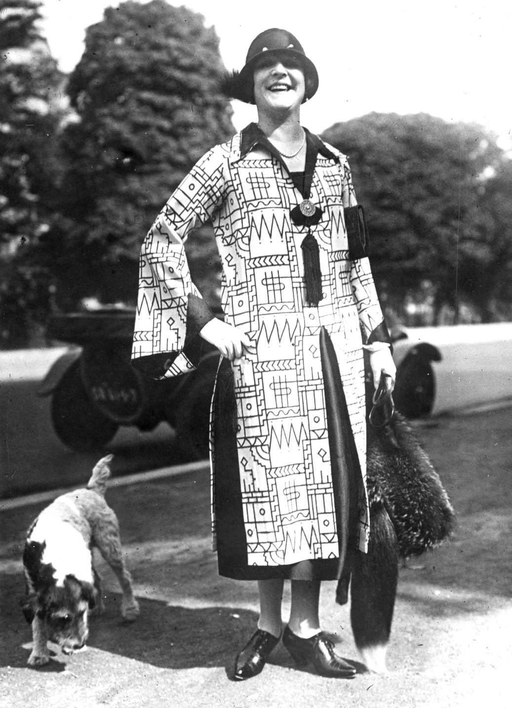 #122 Bold geometric prints on this dress are relieved by panels of black around the cuffs, collar and skirt, 1925