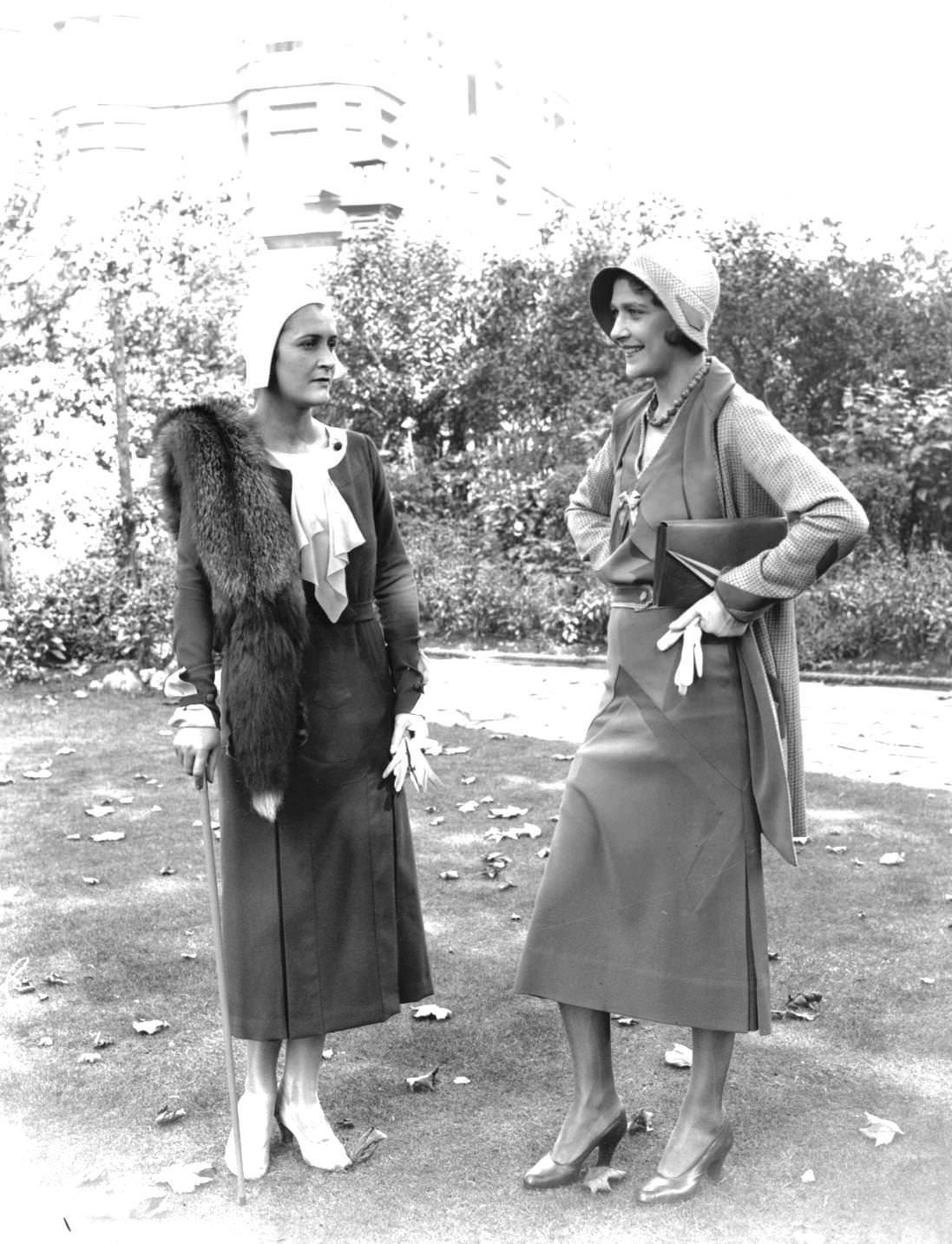 #126 Two women modelling fashionable outfits for Ascot, 1925