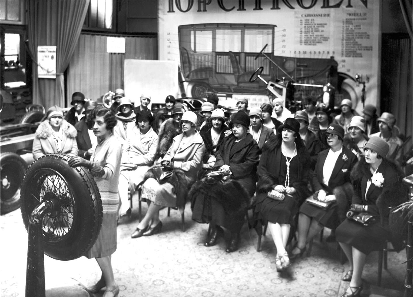 #138 French women in cloche hats attend a car mechanics class run by Ms Versiguy, 1920s