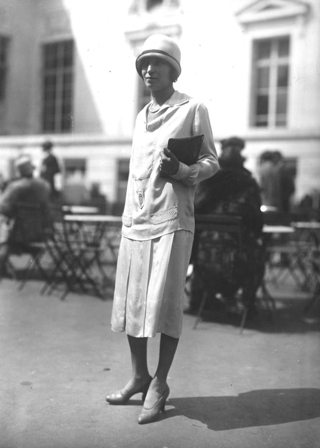 #159 A model wearing a silk day dress with a traditional cloche hat, 1925