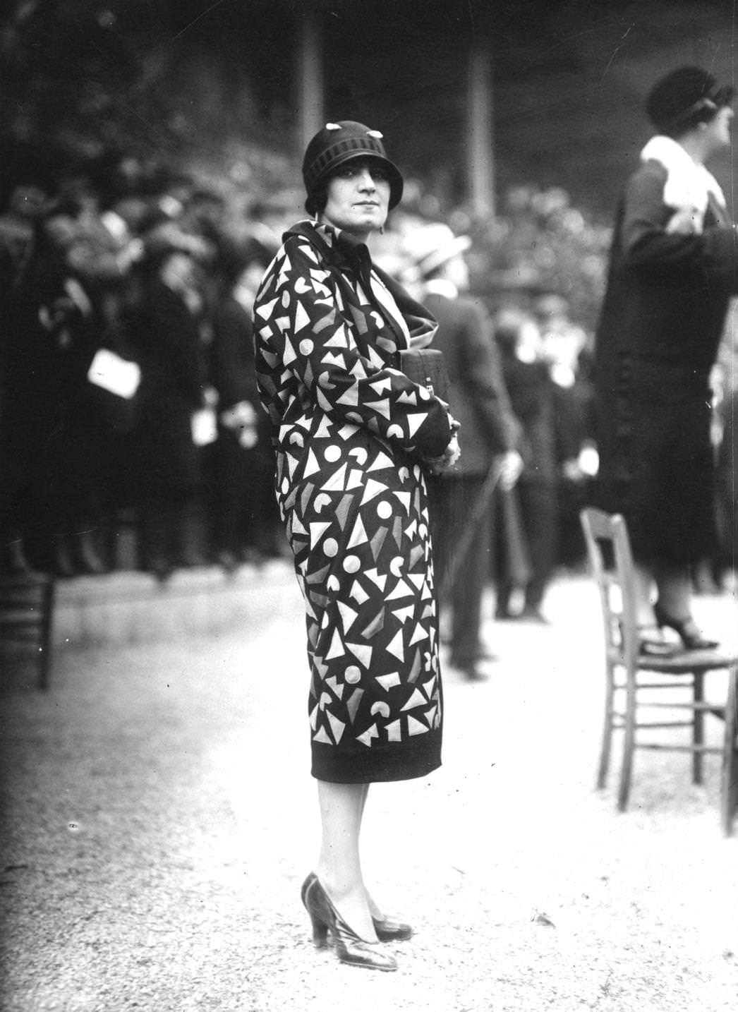 #163 Patterned coat with black trim around the hem and cuffs, 1925