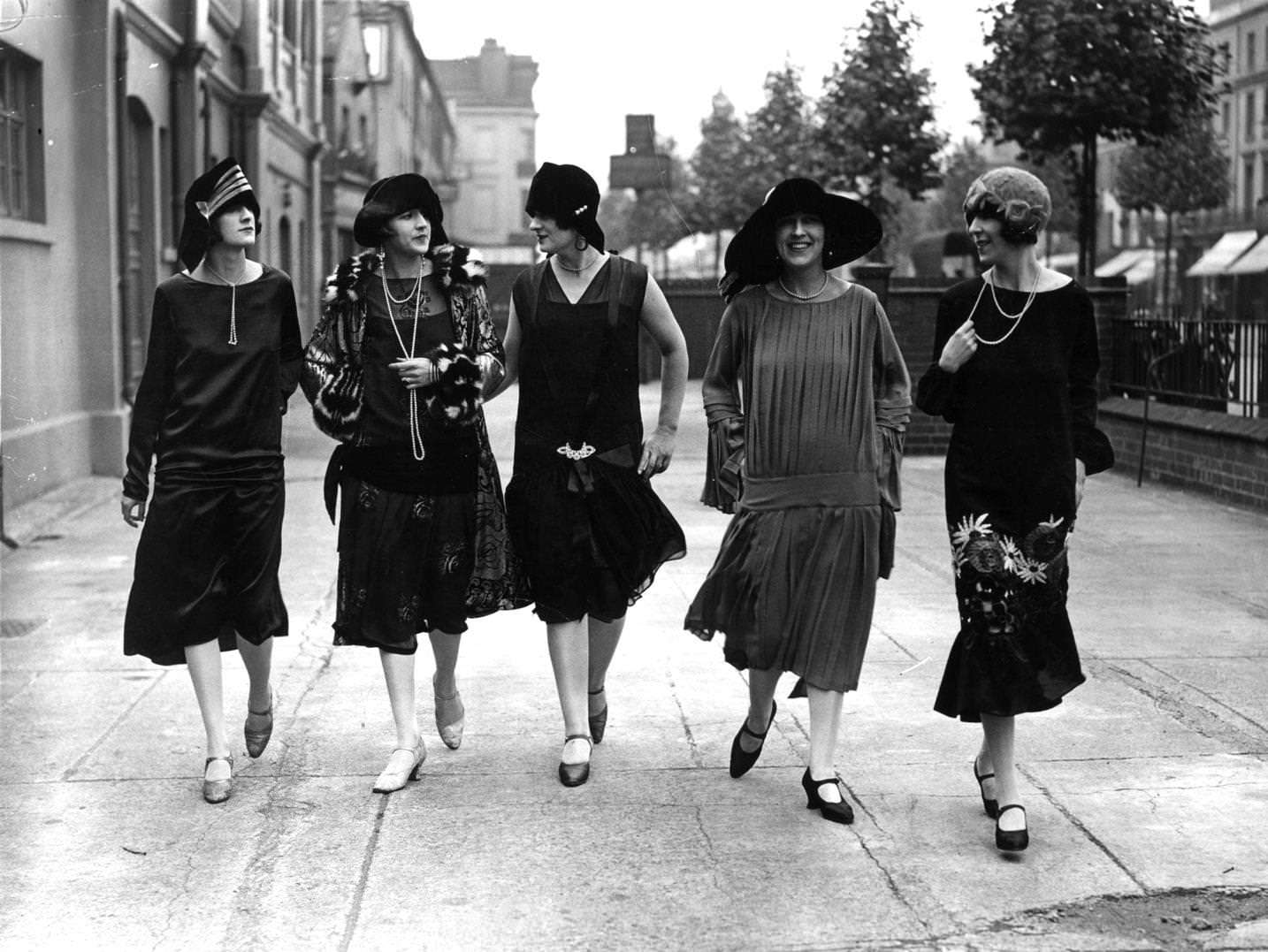 #170 Models outside the fashion exhibition at Holland Park in London wearing comtemporary dropped waist dresses and styles of 25 years ago, 1925