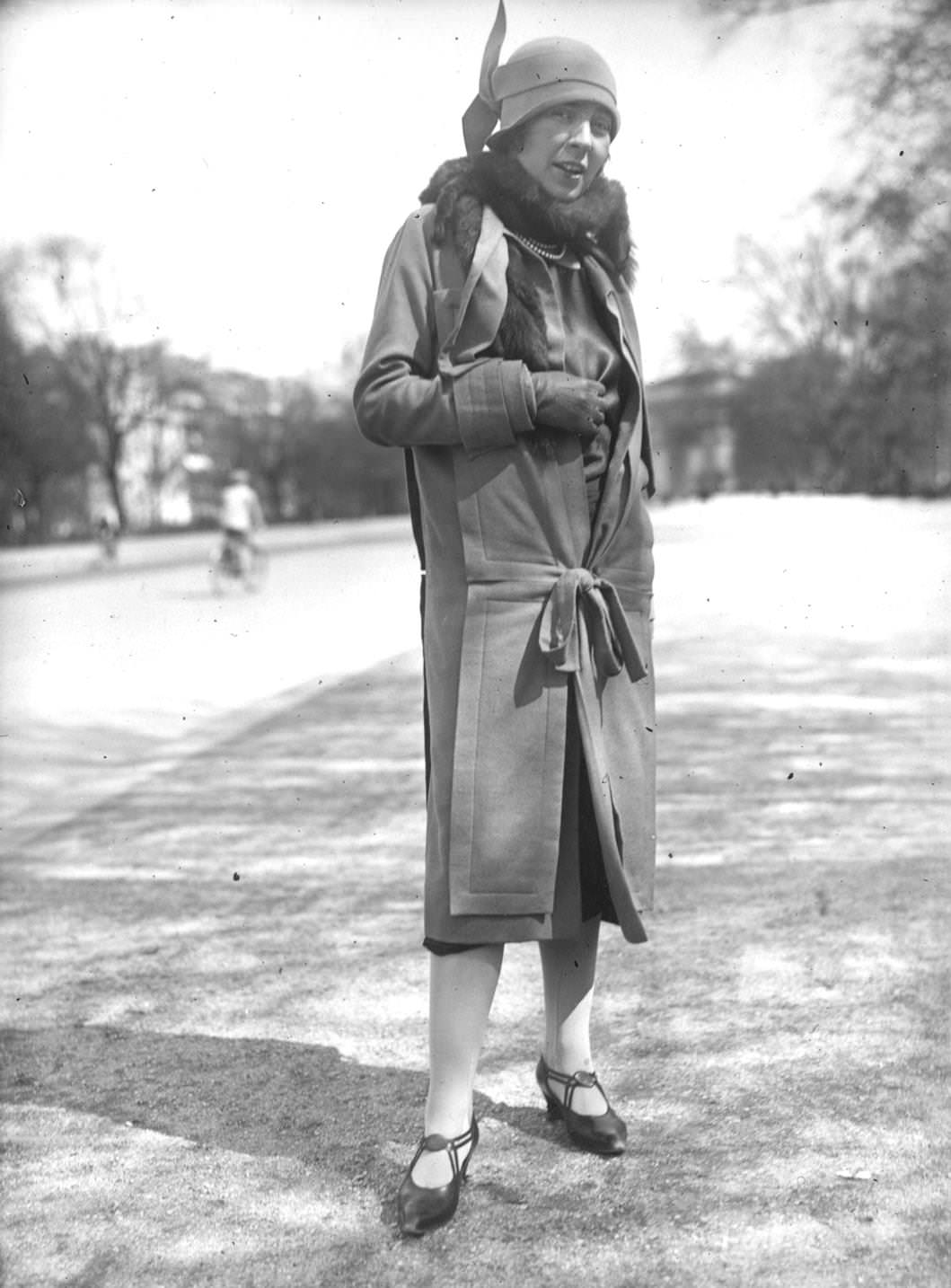 #176 A woman wearing an innovative frock coat with a matching cloche hat, 1925