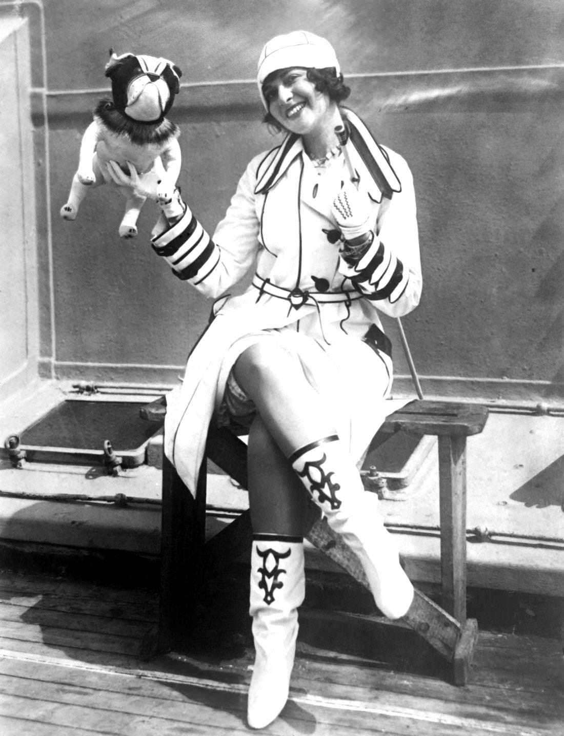 #22 American Actress Fay Marbre in Cloche Hat and a toy dog, 1920