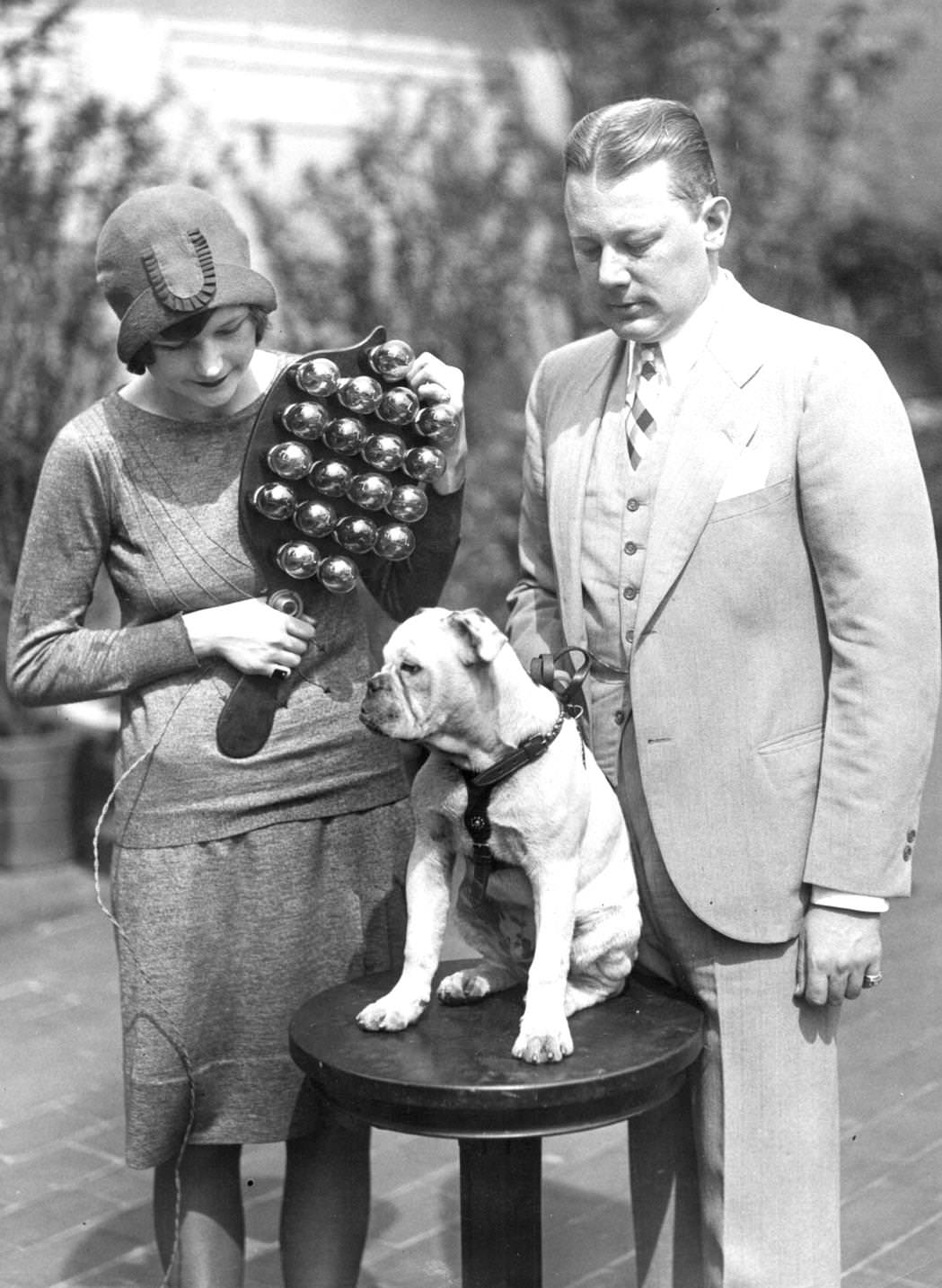 #34 Ethel Lawrence christening the Radio Bull Dog at a ceremony on the roof of the Hotel Astor in New York City, with a christening radio device made by a radio engineer. G Clayton Irwin, 1920