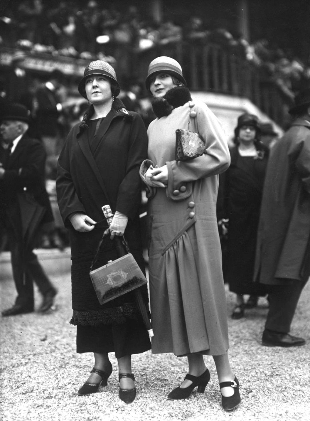 #41 Two women in spring coats, both with cloche hats and handbags, 1924