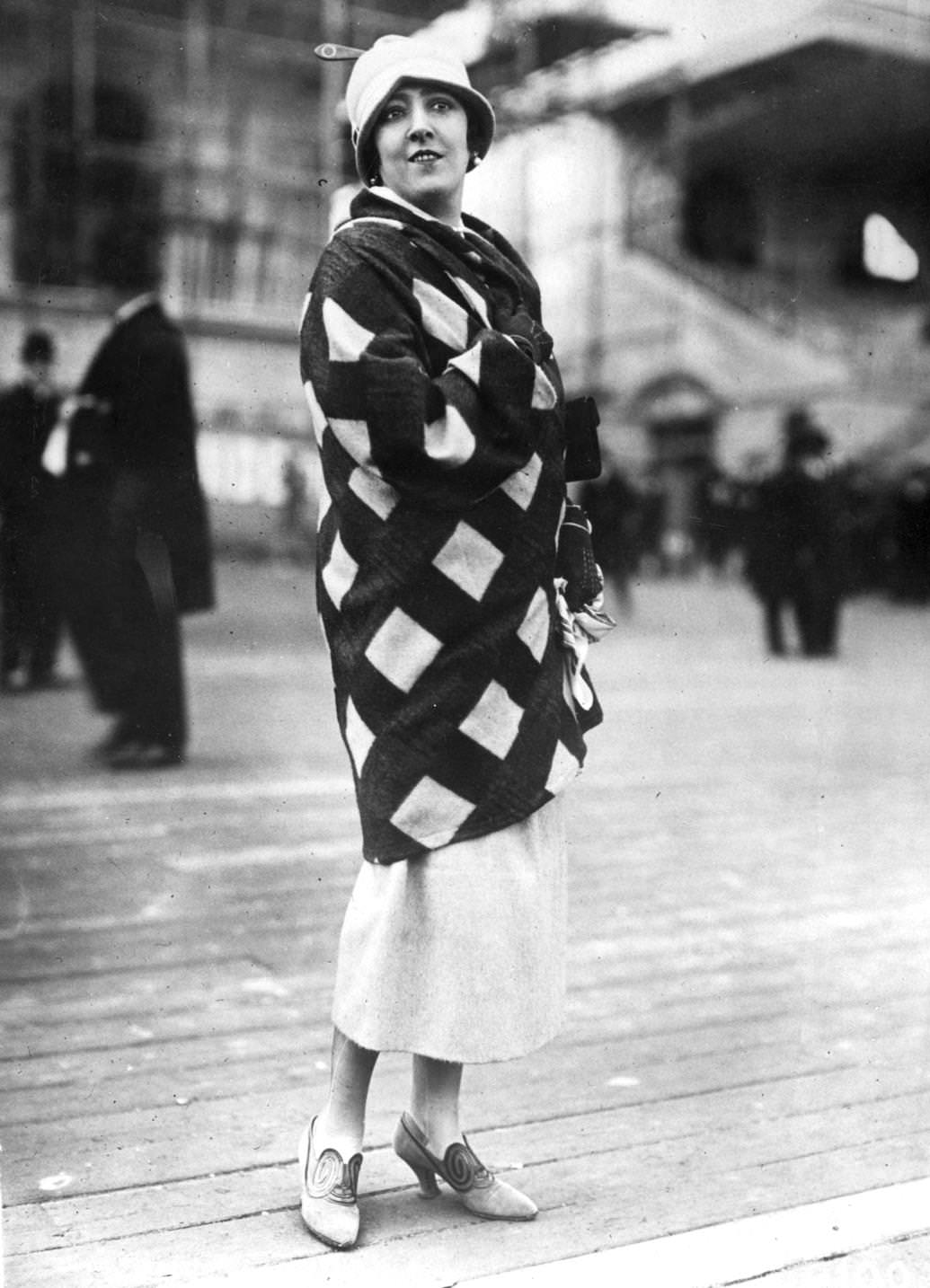 #61 A rust and cream plaid velour coat from Paris, set to be the season’s rage for sports and country wear, 1924