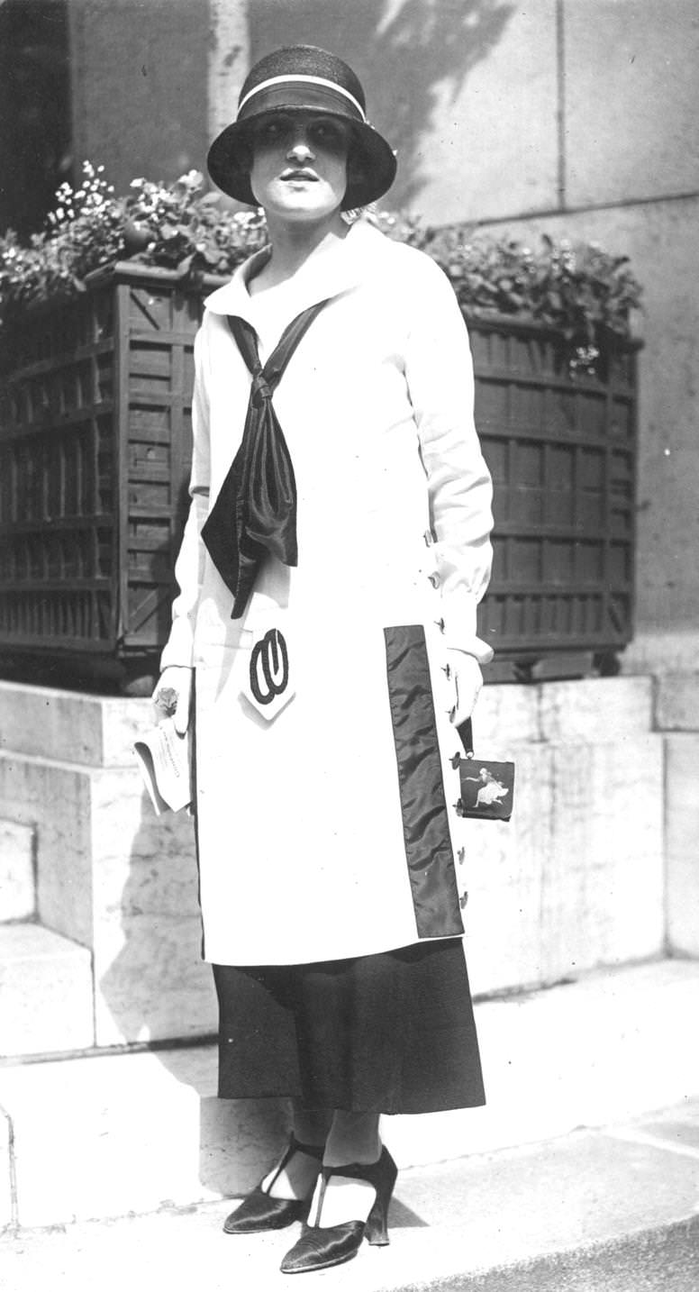 #77 Low waisted, ankle length dress with black silk tie around the collar, 1923