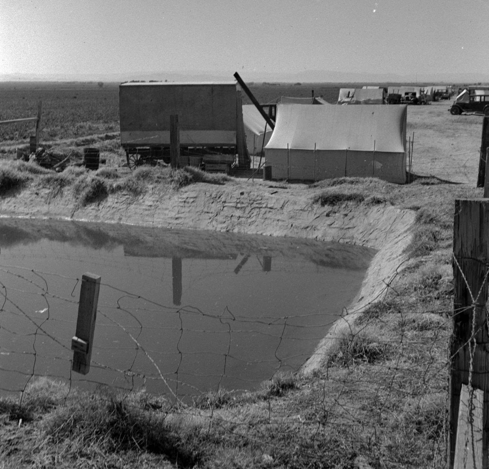 #71 Ditch bank camp for migrant agricultural workers, 1937