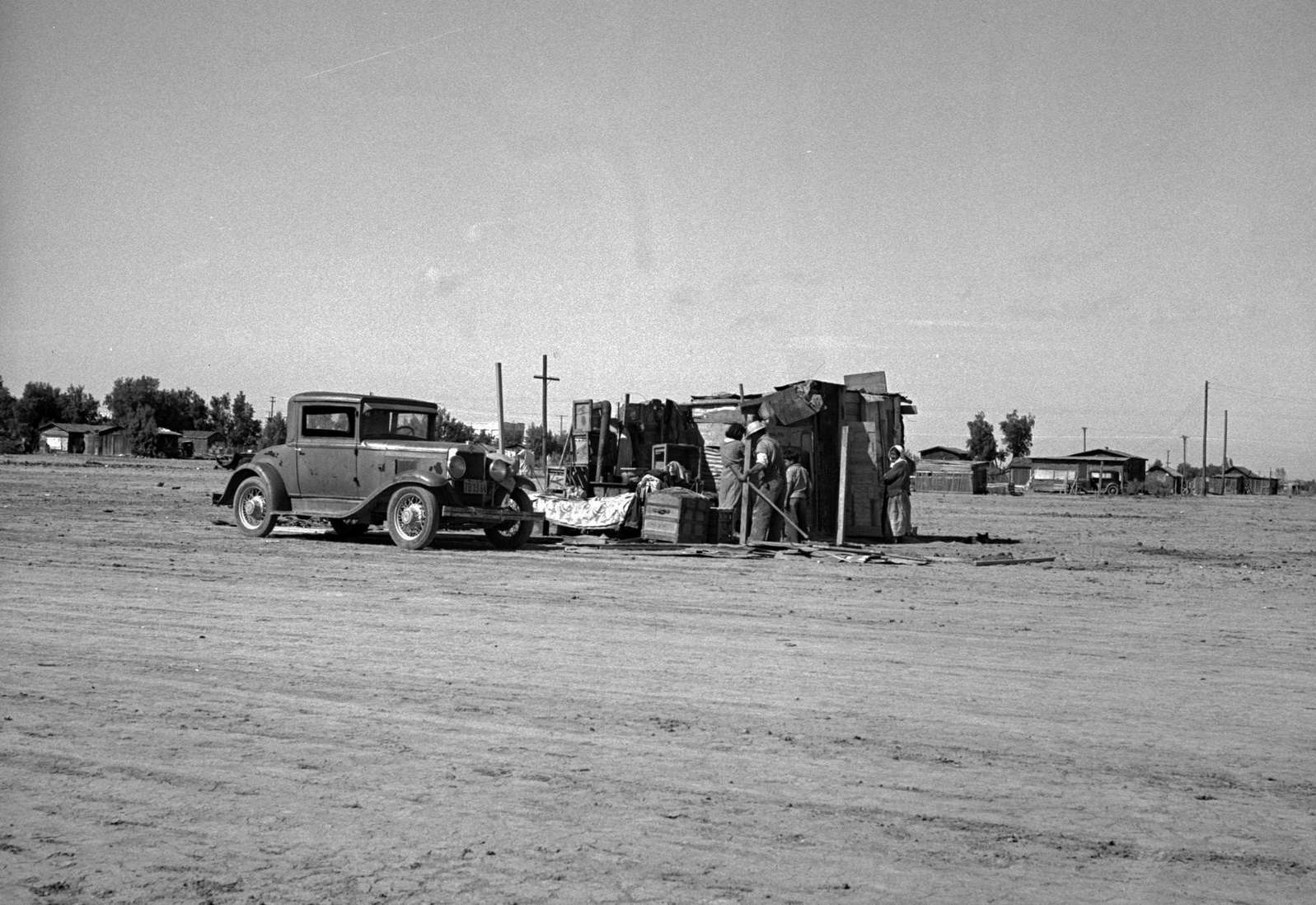 #83 Housing of migratory field workers (Mexican) across road from Farm Security Administration camp (FSA) Near Calipatria, Imperial Valley, California, 1939
