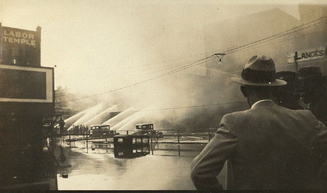 #8 Firefighters spraying water onto building fire, 1935