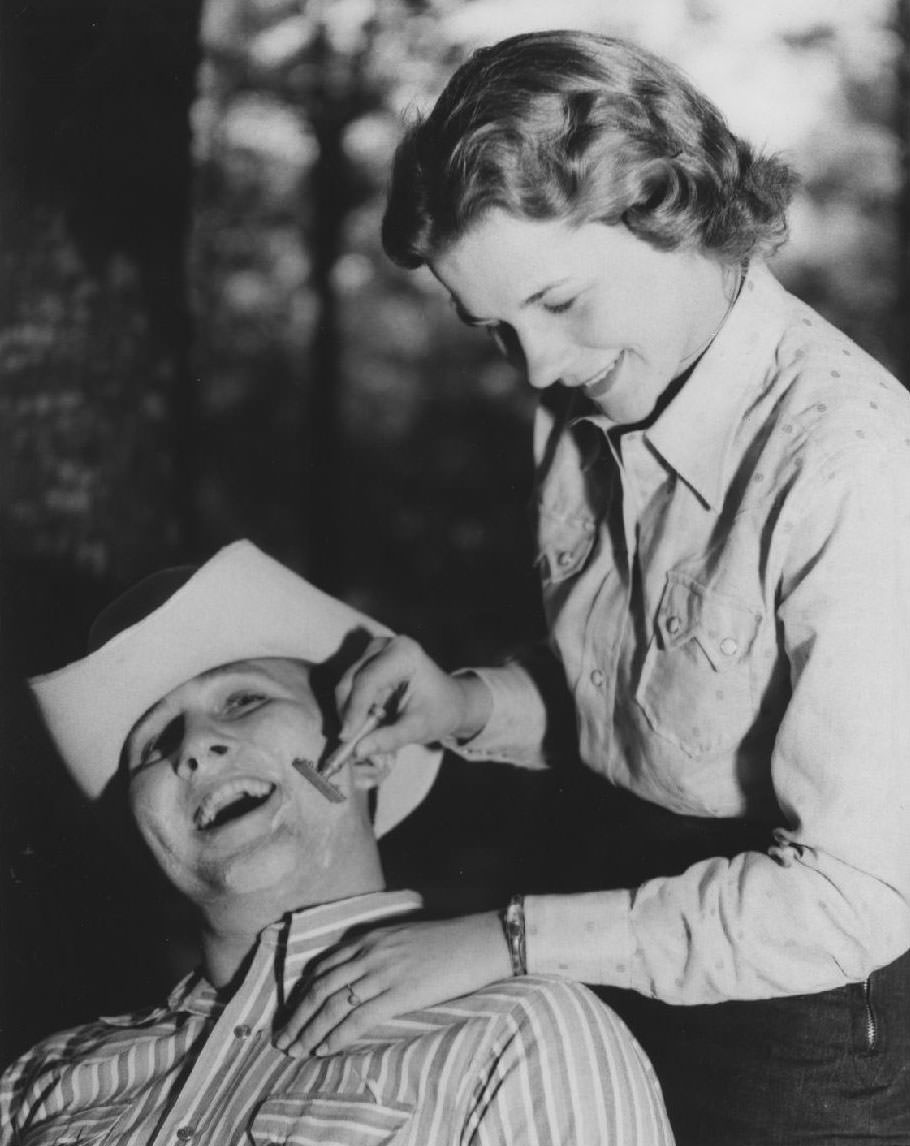 #39 Student shaves man in cowboy hat, 1950s