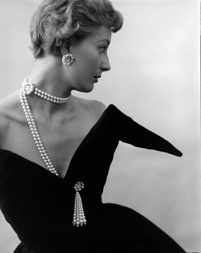 #101 A model poses in a pearl necklace (by Jacques Fath), August 9, 1949.