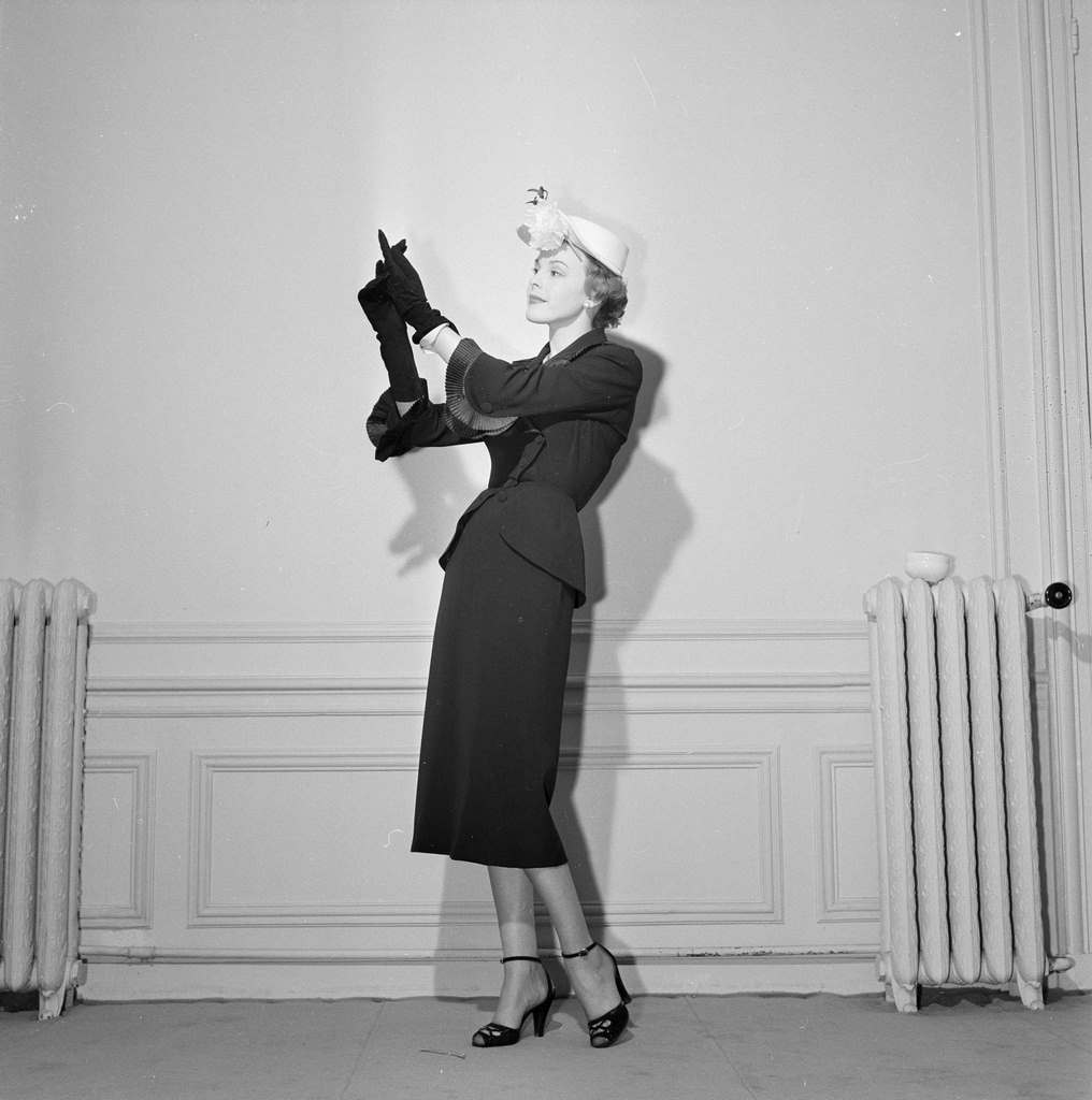 #109 A model posing, wearing clothes, a suit, from Carven, Jean Desses, Jacques Fath, Jeanne Paquin, 1950