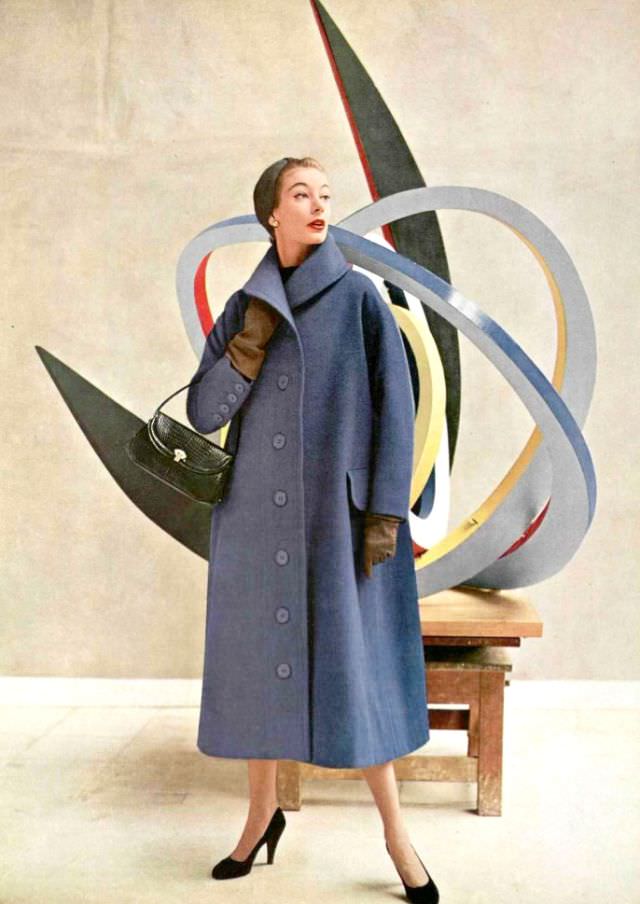 #18 Model in simple but elegant wool coat and grey jersey turban by Jacques Fath, croc handbag by P. & R.Dubost, 1952
