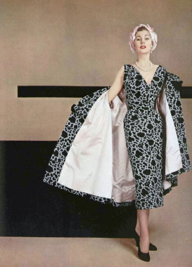 #27 Stella in black and white silk ottoman cocktail sheath with matching coat lined in pink satin by Jacques Fath, 1953