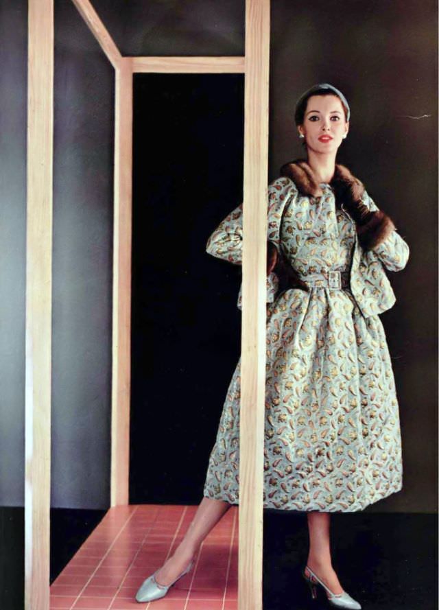 #29 Ann Farrar in sumptuous brocade dress and jacket trimmed in mink by Jacques Fath, 1954