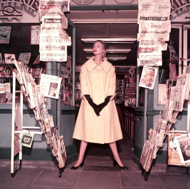 #39 La Librairie”, Carmen Dell’ Orefice is wearing coat by Jacques Fath, photo by Georges Dambier, Paris, 1954