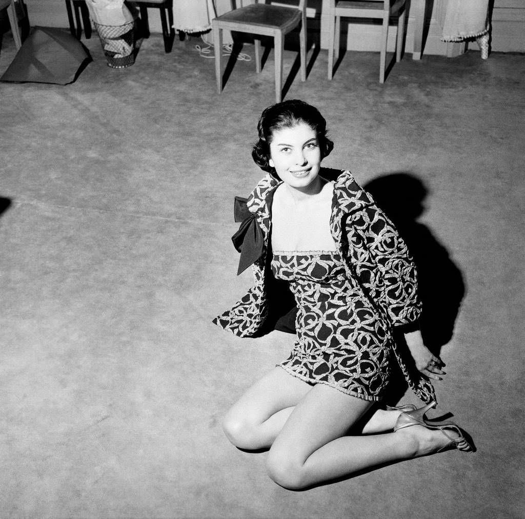 #68 Model wearing a Jacques Fath model in 1957.