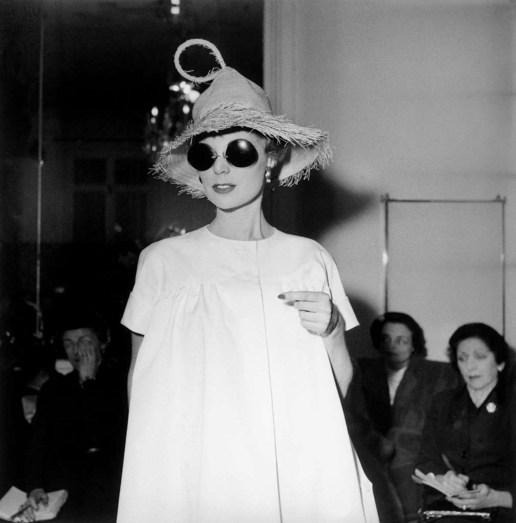 #79 A model presenting an outfit from the new collection by fashion designer Jacques Fath, 1954