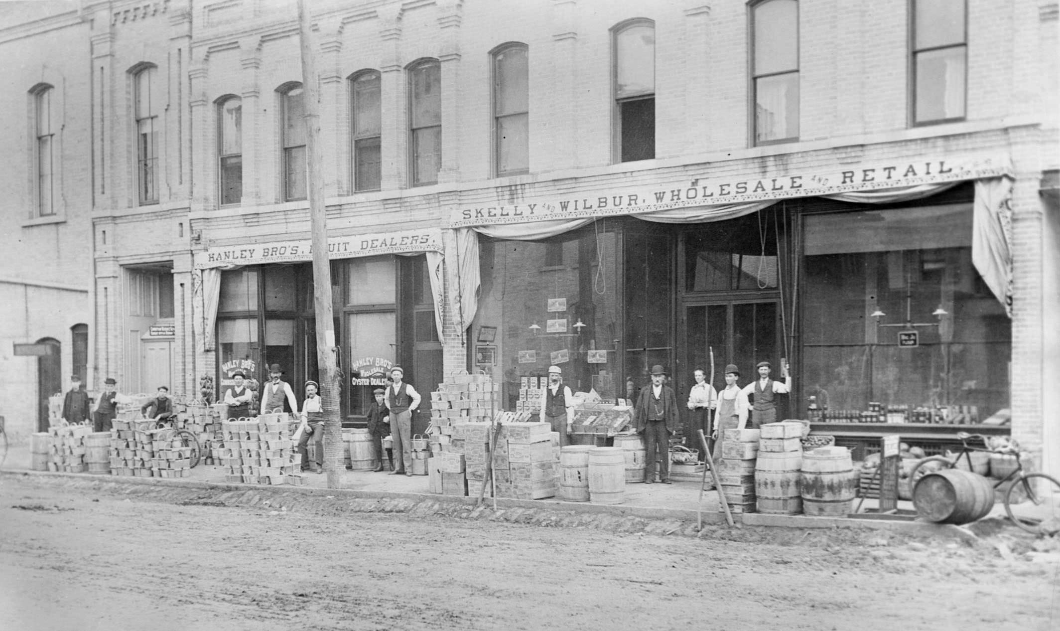#85 Jackson Street merchants with their wares, 1890